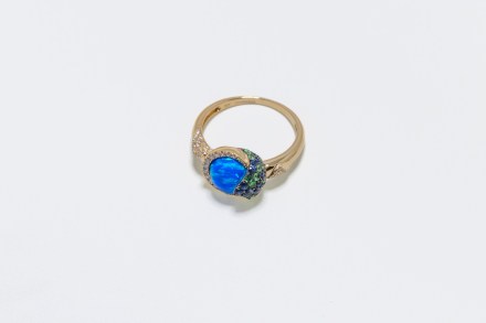 14K yellow gold ring set with sapphires, diamonds, and garnets from the Melissani Collection