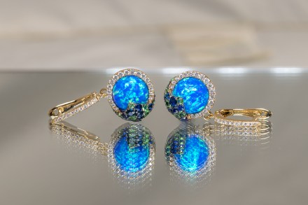 14K yellow gold earrings set with sapphires, diamonds, and garnets from the Melissani Collection